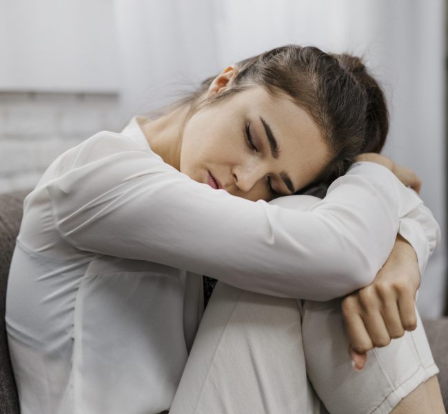sideways-woman-looking-sad-as-she-works-from-home Counselling